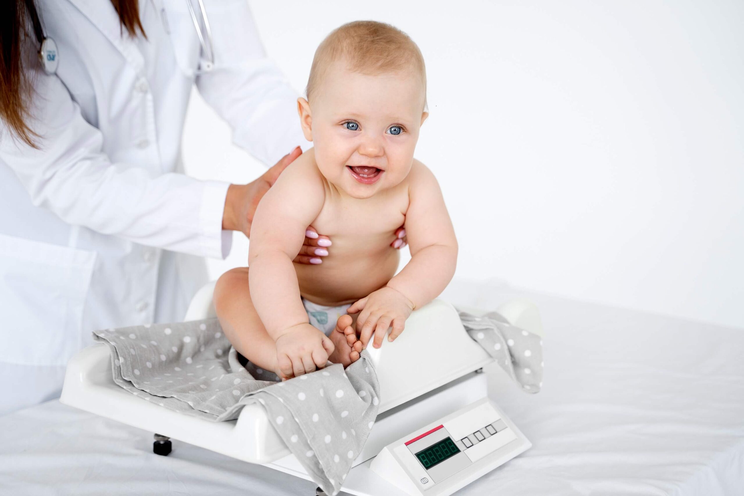 adult-taking-care-baby-weight